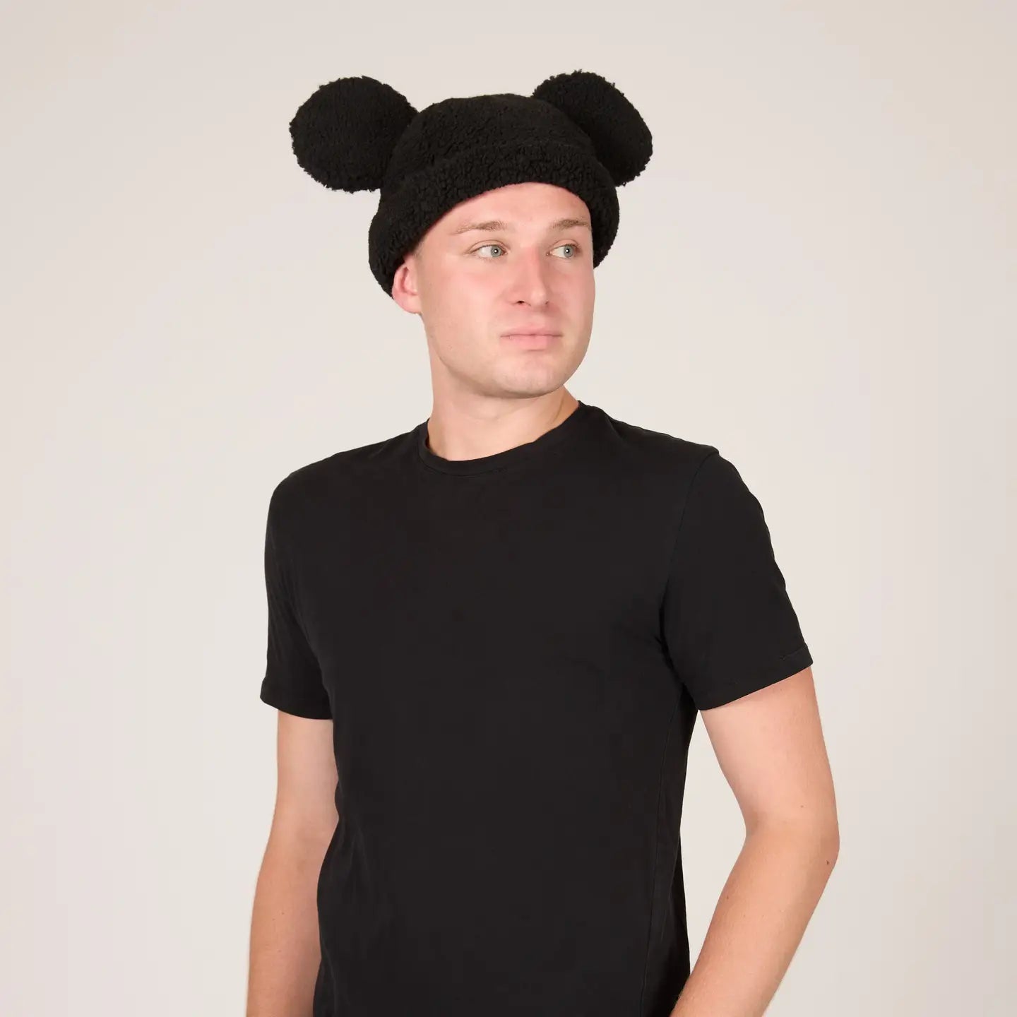 Person wearing a a Mickey Sherpa Beanie Classic Black with Mickey ears on a plain background