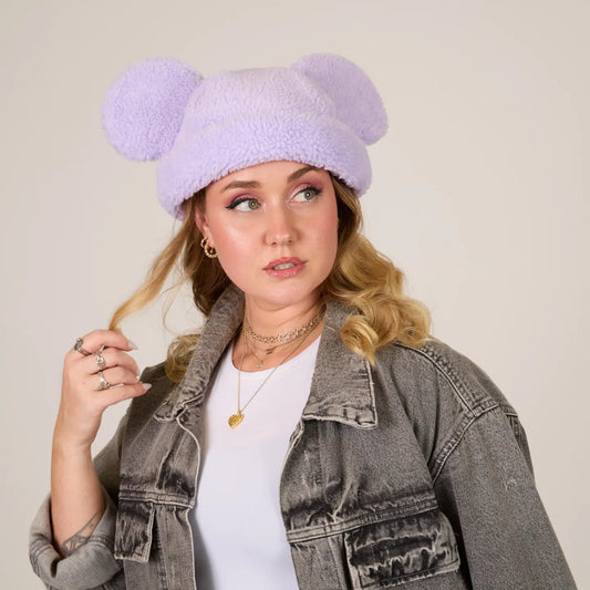 Woman wearing a Mickey Sherpa Beanie Lavender with Mickey ears against a plain background