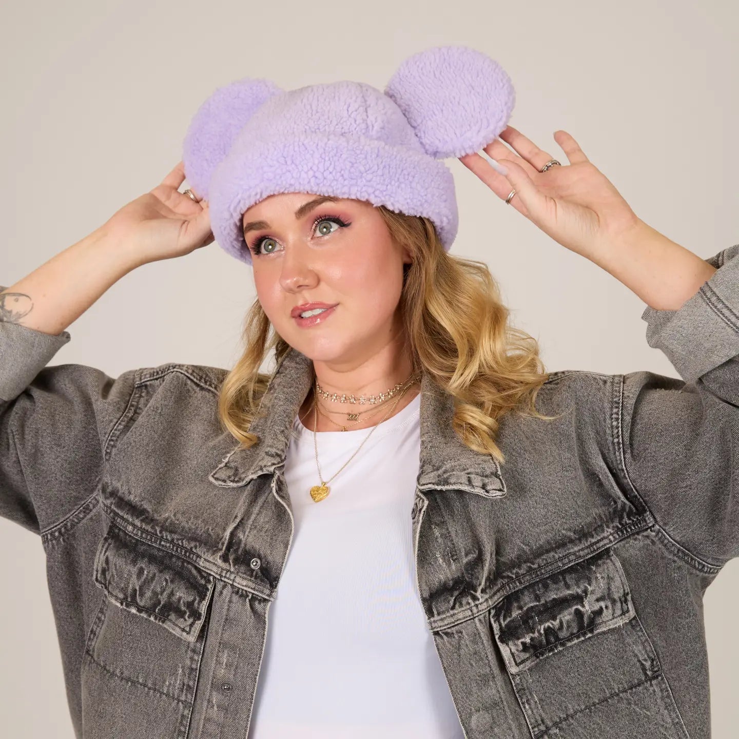 Person wearing a Mickey Sherpa Beanie Lavender with Mickey ears, posing against a plain background.
