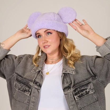 Person wearing a Mickey Sherpa Beanie Lavender with Mickey ears, posing against a plain background.