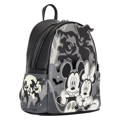 A Disney Mickey and Minnie Mouse backpack featuring a gray and black camouflage pattern with black silhouettes of Mickey, Minnie, and other Disney characters, plus a black front pocket with a moon and Mickey silhouette print.