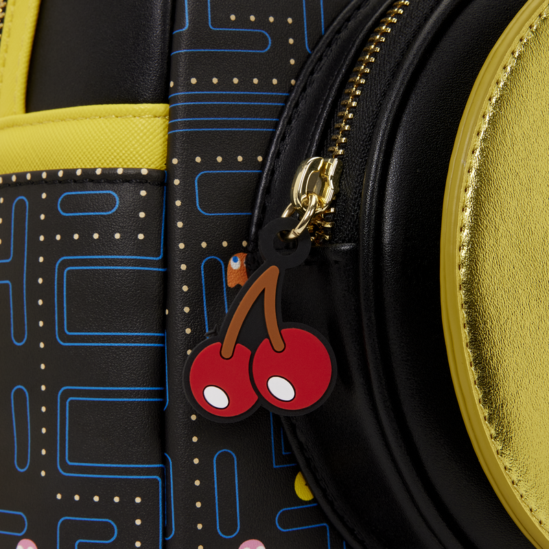 Close-p of Loungefly Pac-Man Glow Mini Backpack with video game pattern and cherry fruit zipper pull 