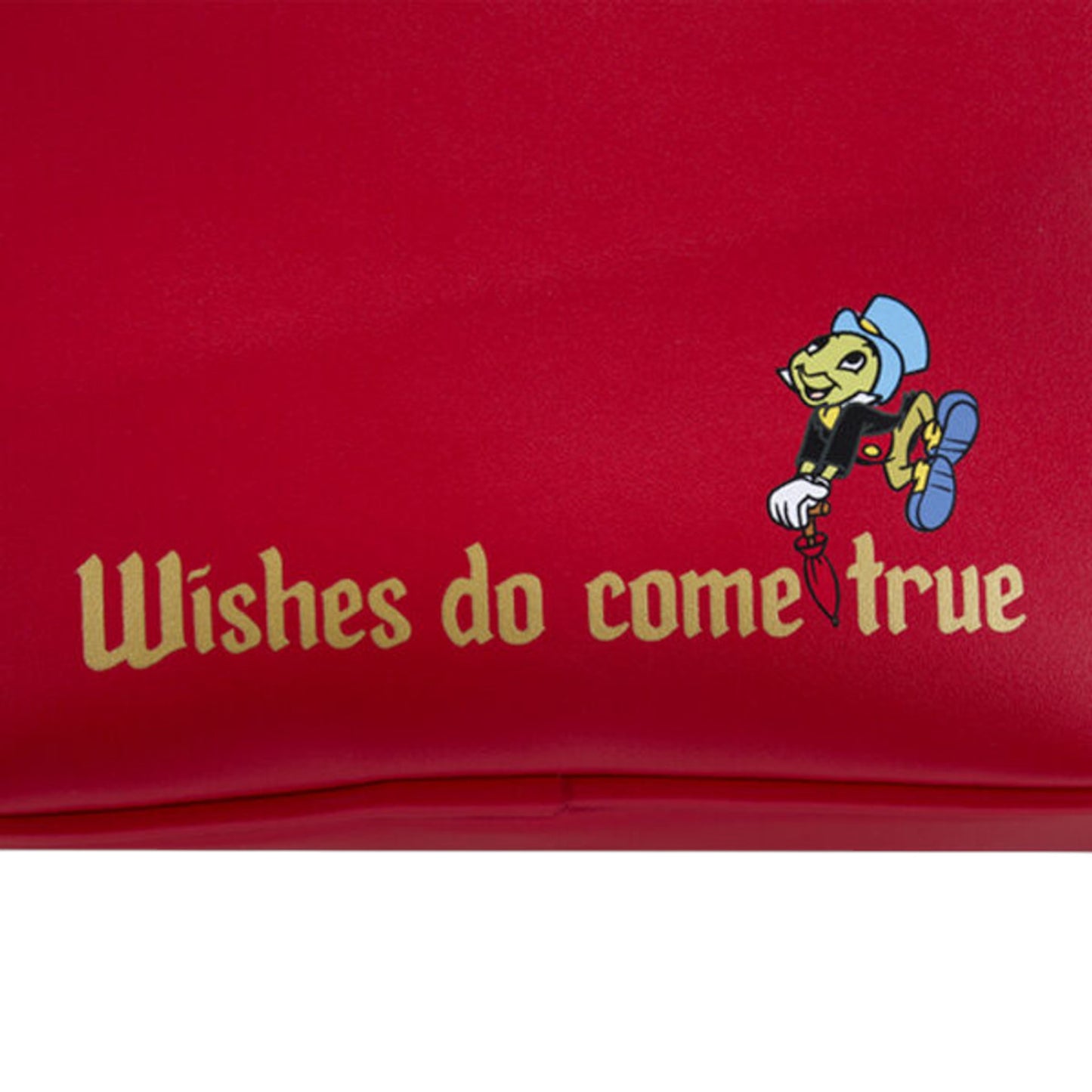Red bag with Jiminy Cricket character and 'Wishes do come true' text on a white background