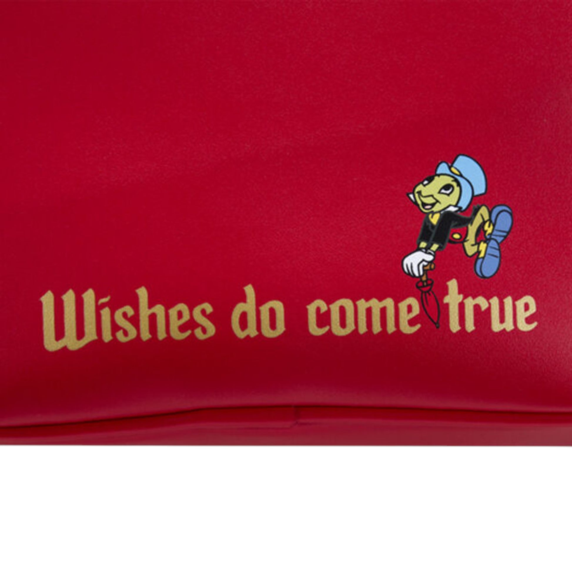 Red bag with Jiminy Cricket character and 'Wishes do come true' text on a white background