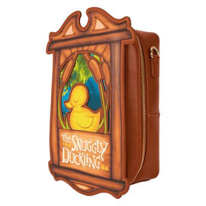 Crossbody bag with snuggly duckling illustration and 'The Snuggly Duckling' text, framed in wood a brown leather strap with gold hardware on a white background