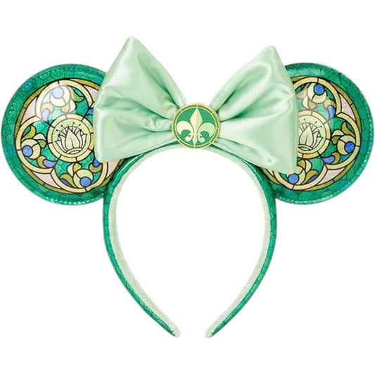 Green Minnie Mouse ears with a bow and Princess and the Frog stained glass pattern on a white background
