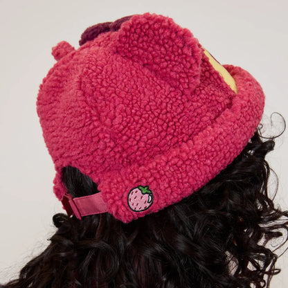 Pink Toy Story Lotso Sherpa Beanie with a small logo on a person wearing it.