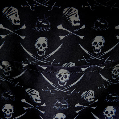 Close-up of inside of Loungefly Pirates of the Caribbean Jack Sparrow Cosplay Mini Backpack with black fabric with skull and crossbones pattern on a black background