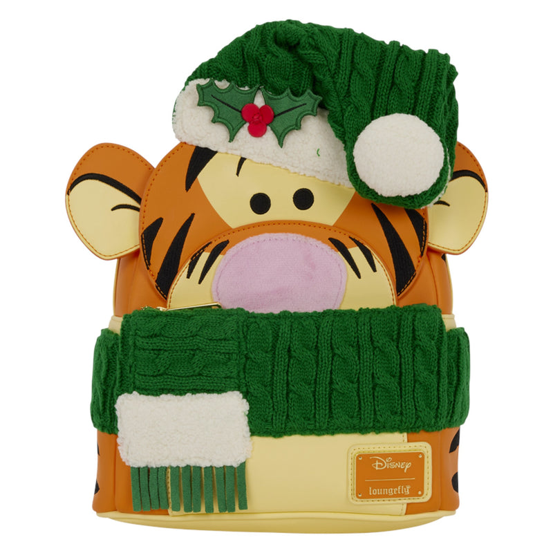 A Disney Tigger Christmas-themed mini backpack featuring Tigger's face, a green knit Santa hat with holly, and a green knit scarf with white faux fur trim, on a solid white background.