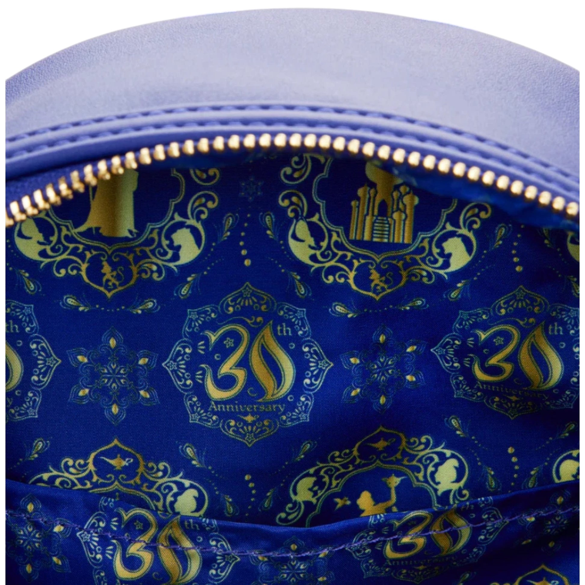 Close-up of a blue bag with gold patterns and '30th Anniversary' text.