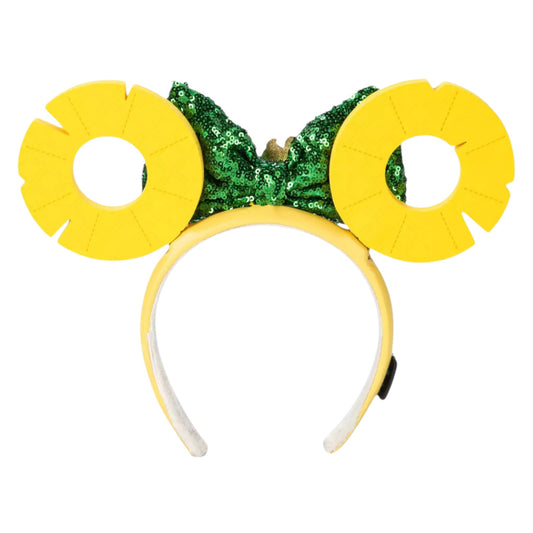 Yellow headband with green sequin bow on a white background