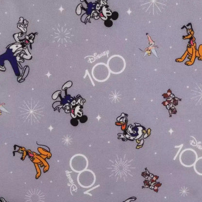 Disney-themed fabric with mickey and friends characters and 'Disney 100' text on a gray background