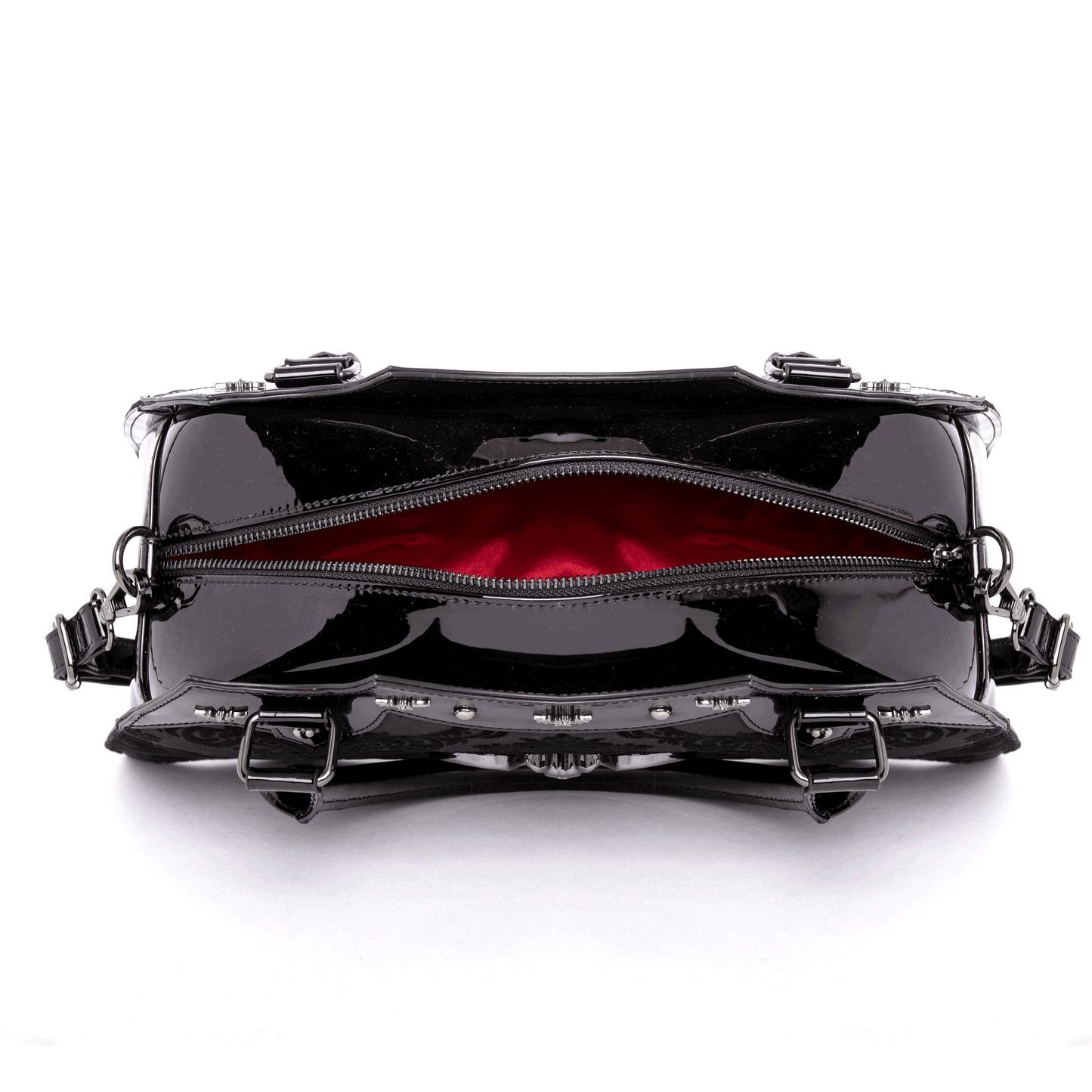 Top view of opened black bat shaped bag with red interior on a white background
