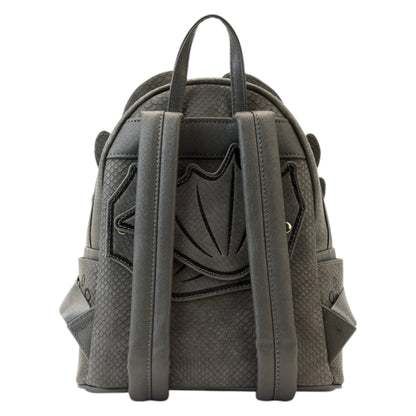 Gray How To Train Your Dragon Toothless Cosplay Mini Backpack designed like a dragon with yellow eyes and a pink tongue with a shield design on a white background