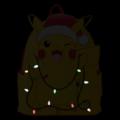 Glowing Pokémon Santa Pikachu character wrapped in Christmas lights with a Santa hat on a dark background