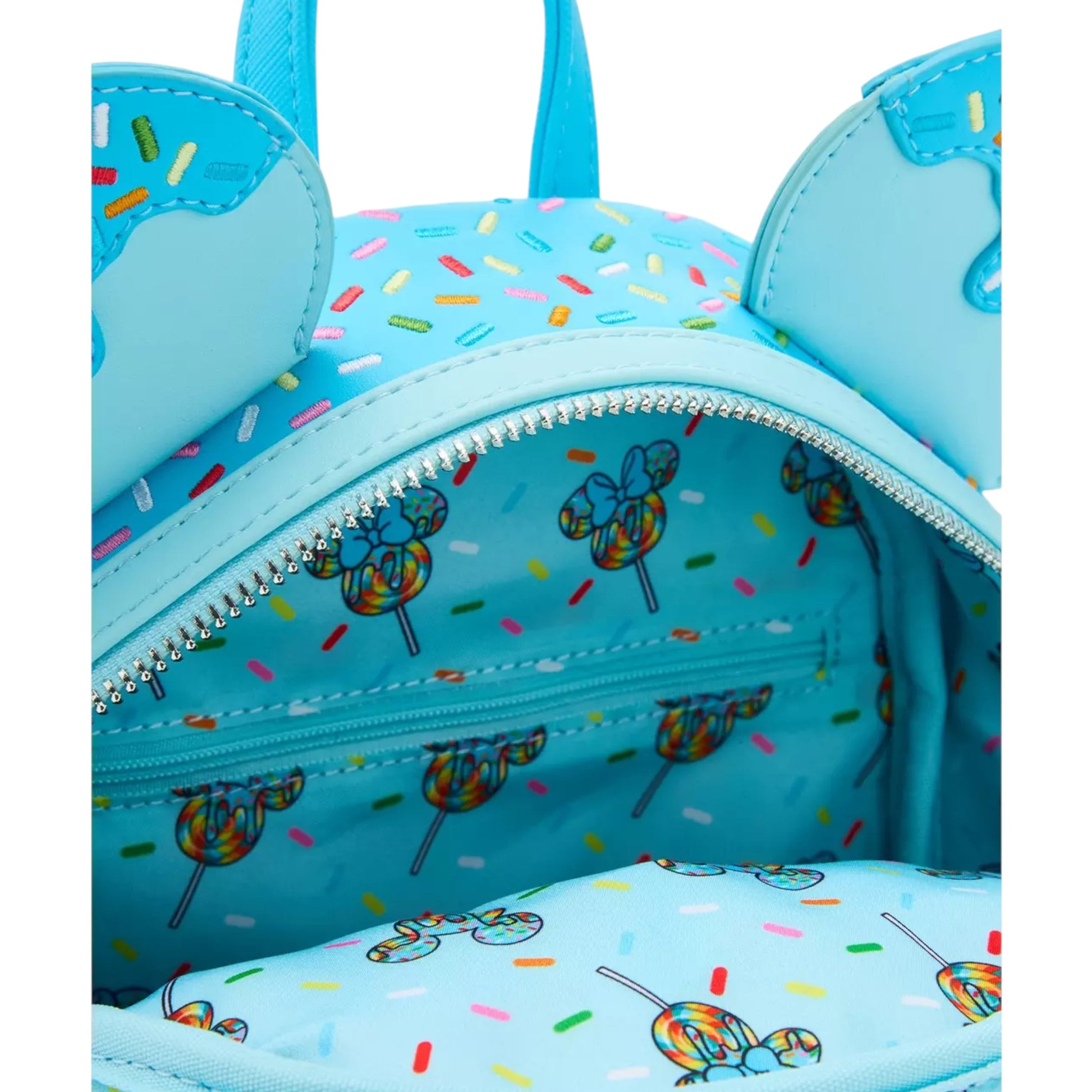 Light blue backpack with lollipop-themed design on a white background
