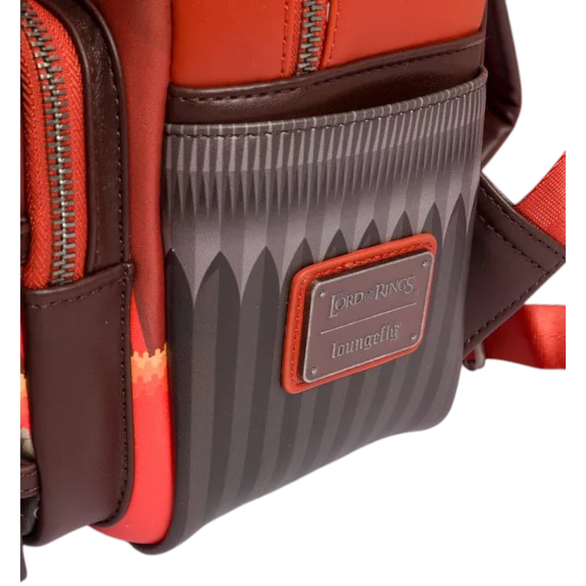 Close-up of a red and brown backpack with a visible The Lord of the Rings and Loungefly brand label on a white background