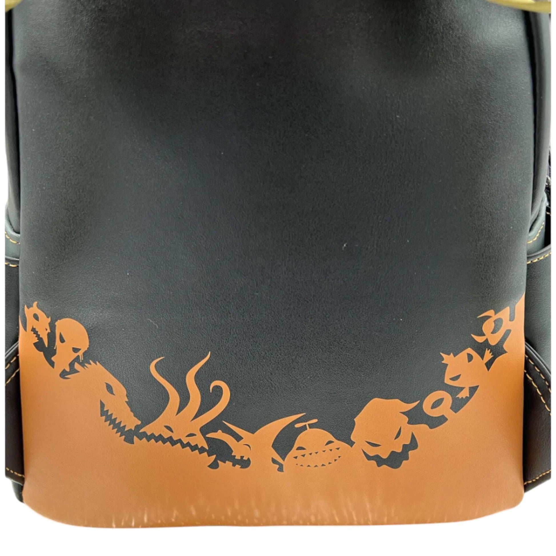 Black and brown bag with various NBC designs on a white background