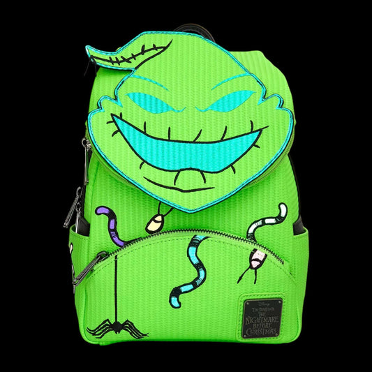 Green backpack glowing with Oogie Boogie face design on a black background