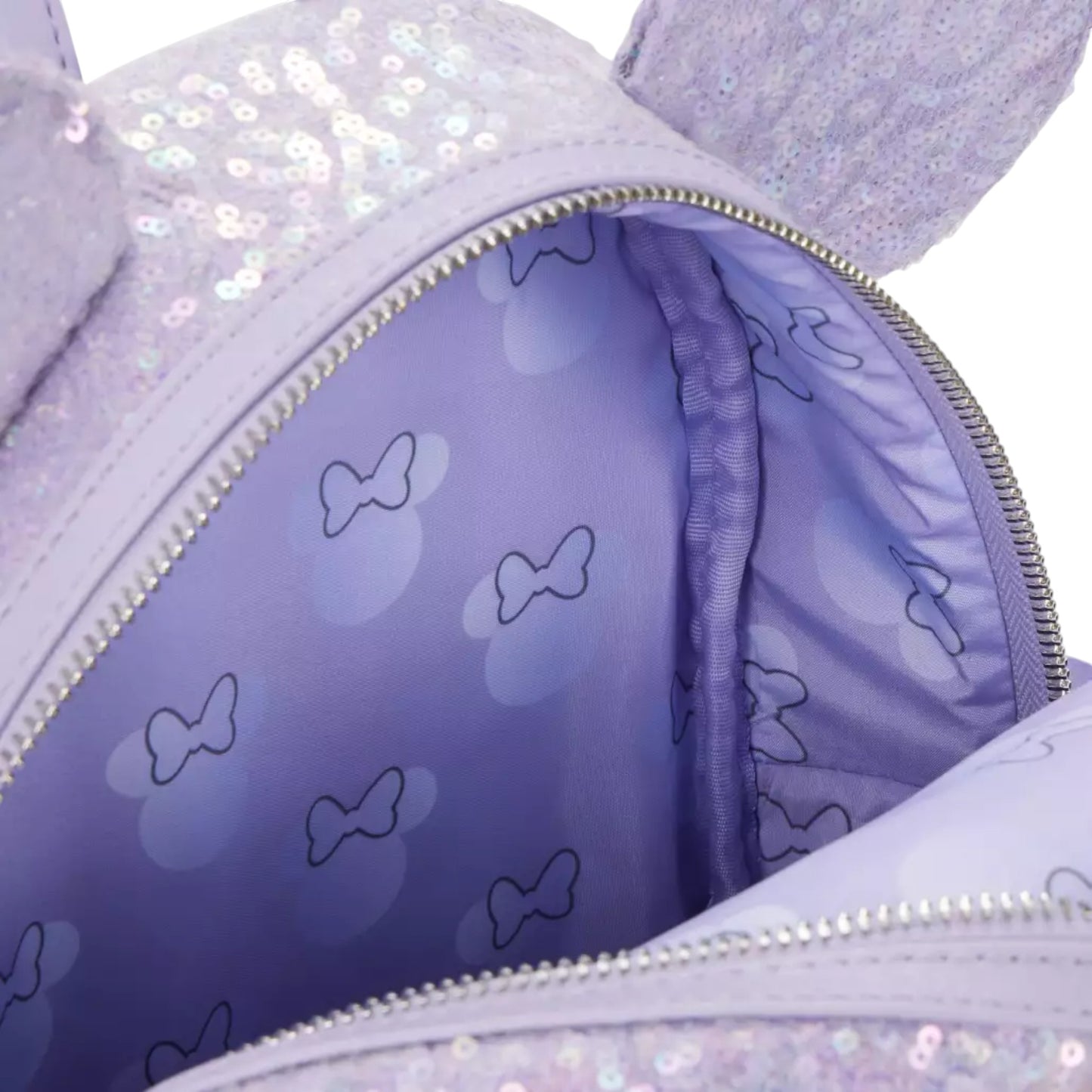 Close-up of a Sequin Opalescent Lavender bag with minnie mouse head patterns on a white background