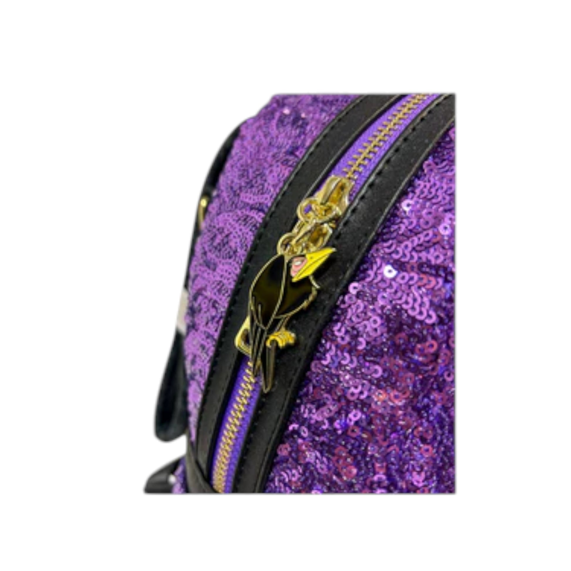 Purple sequin bag with gold diablo raven design on zipper on a white background