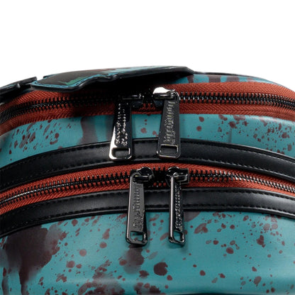 Close-up of a multicolored bag with zippers and blood splatter pattern