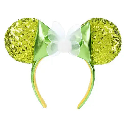 Green glittery mouse ears with a bow on a white background