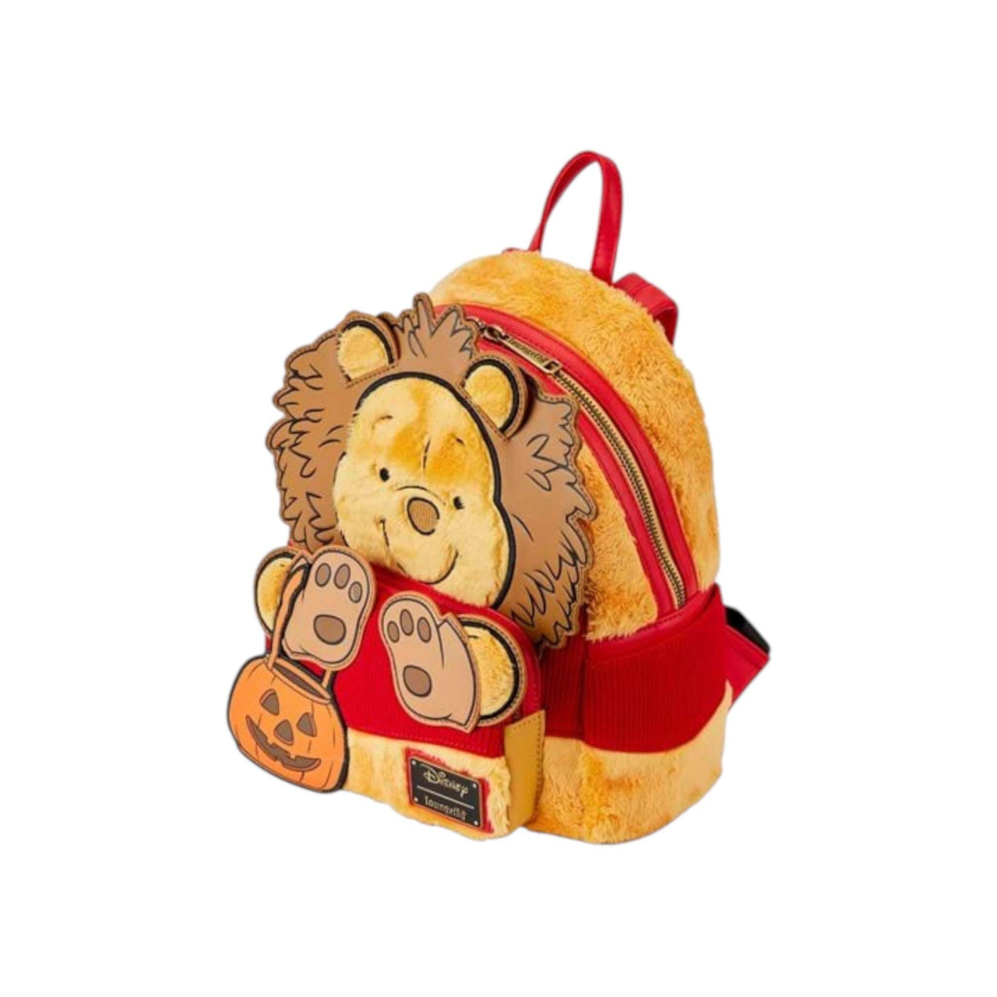 Plush Winnie the Pooh  backpack with red accents on a white background